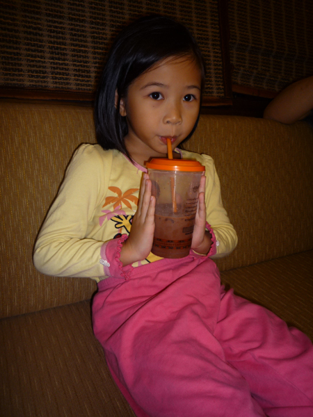 Girl drinking chocolate in pyjamas
