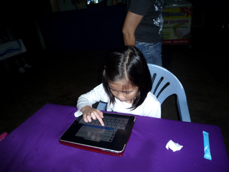 Girl playing ipad