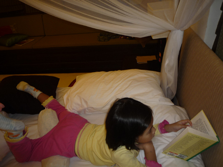 Girl reading in bed