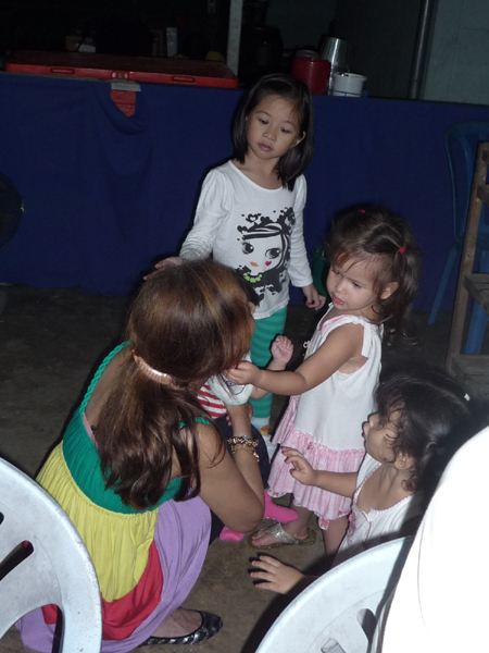 Girls admiring baby