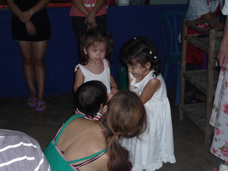 Girls playing with baby